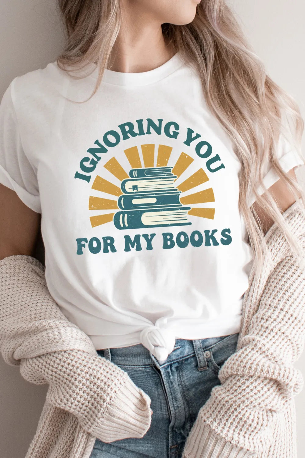 woman wearing Cozy gift t-shirt for readers who’d rather stay in and read with “Ignoring You for My Books” quote