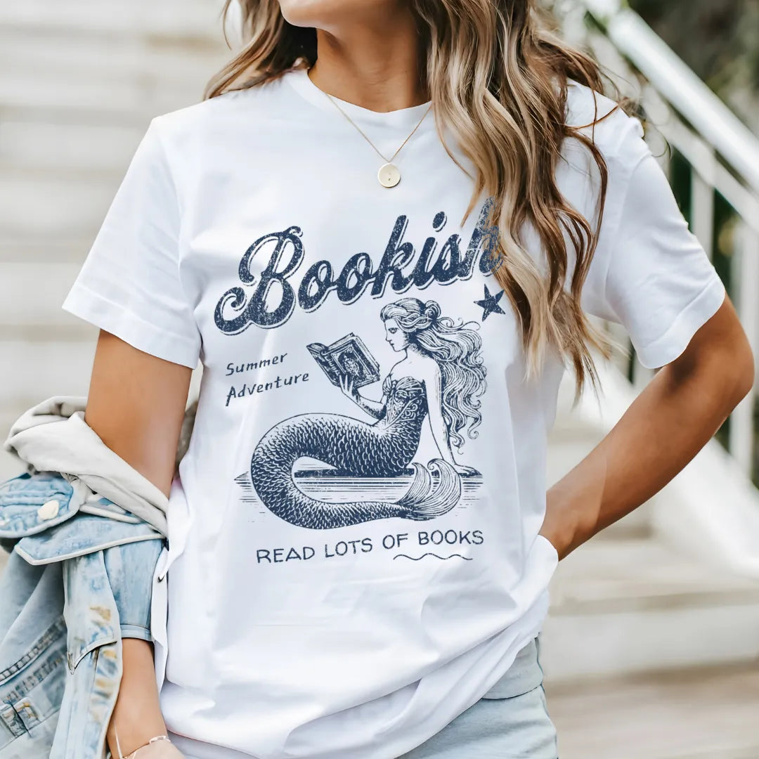 whimsical vintage tee with mermaid and books