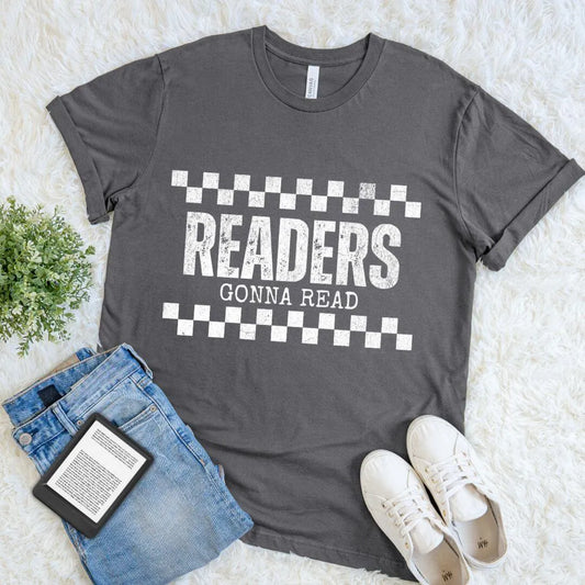 Flat lay of soft cotton t-shirt with "readers gonna read" quote and checkerboard pattern design