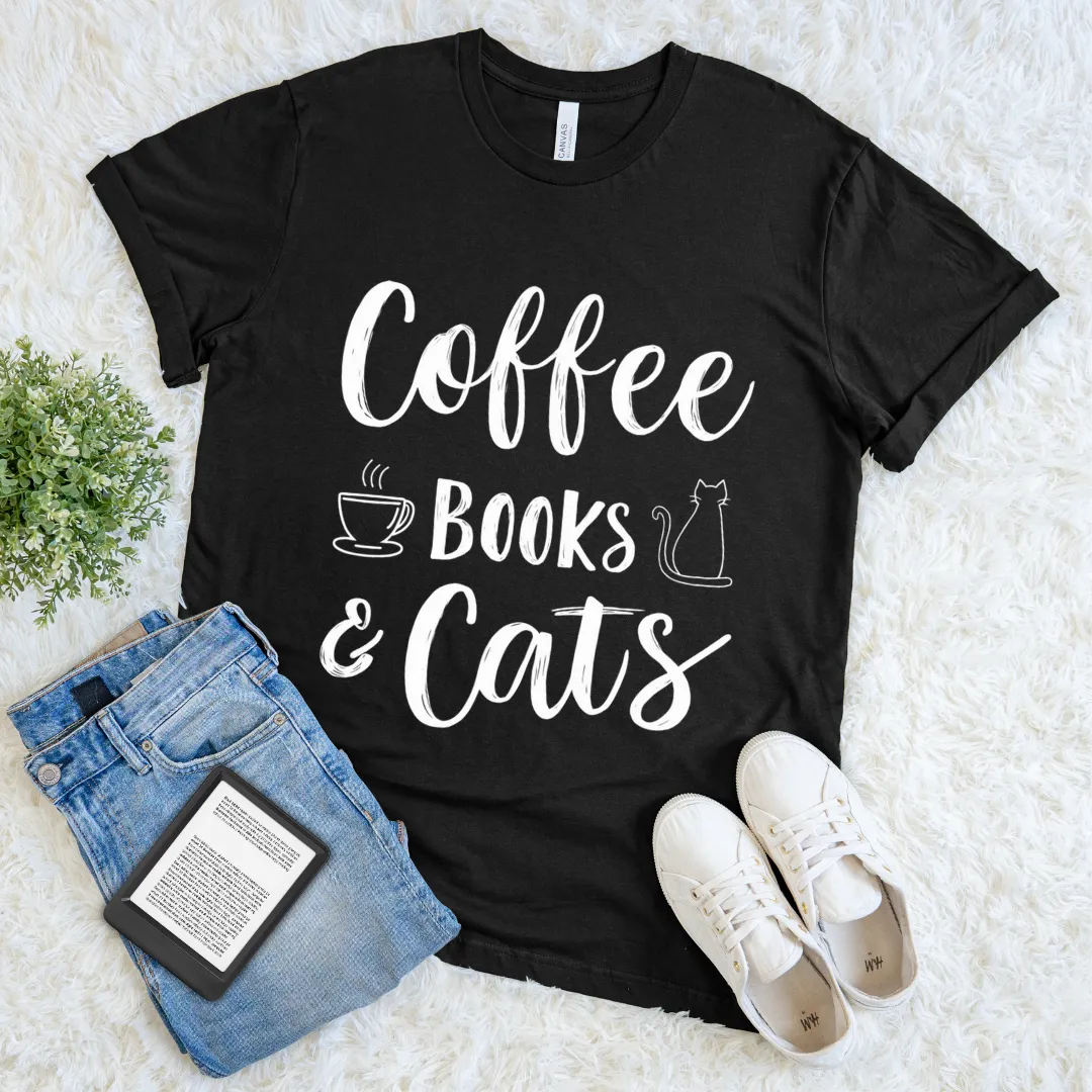 Black T-shirt with white text “Coffee Books & Cats” and minimalist doodle