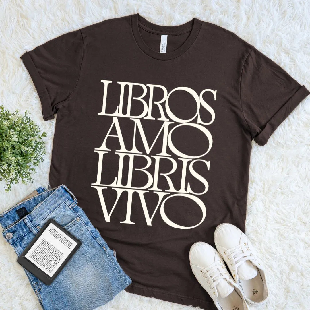 Brown dark academia bookish tee displaying Libros Amo Libris Vivo in cream serif lettering, paired with casual reading essentials