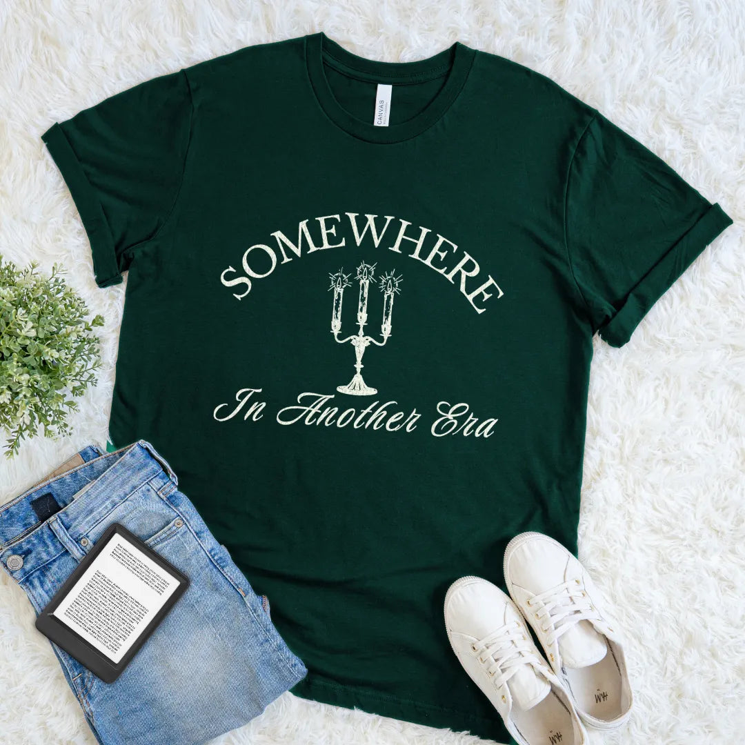 Dark forest green bookish T-shirt with Somewhere In Another Era ivory typography and candelabra graphic