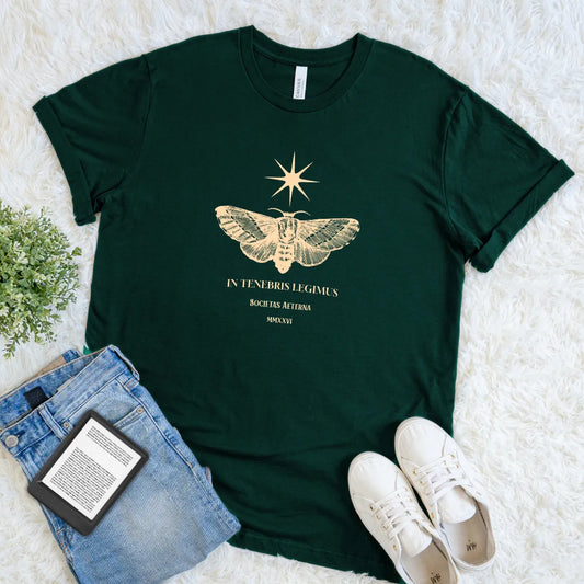 Soft cotton forest green t-shirt featuring latin quote in golden typography and vintage moth and stars design