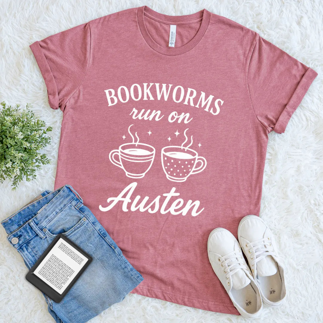 Reader mauve shirt combining books, beverages, and literary flair