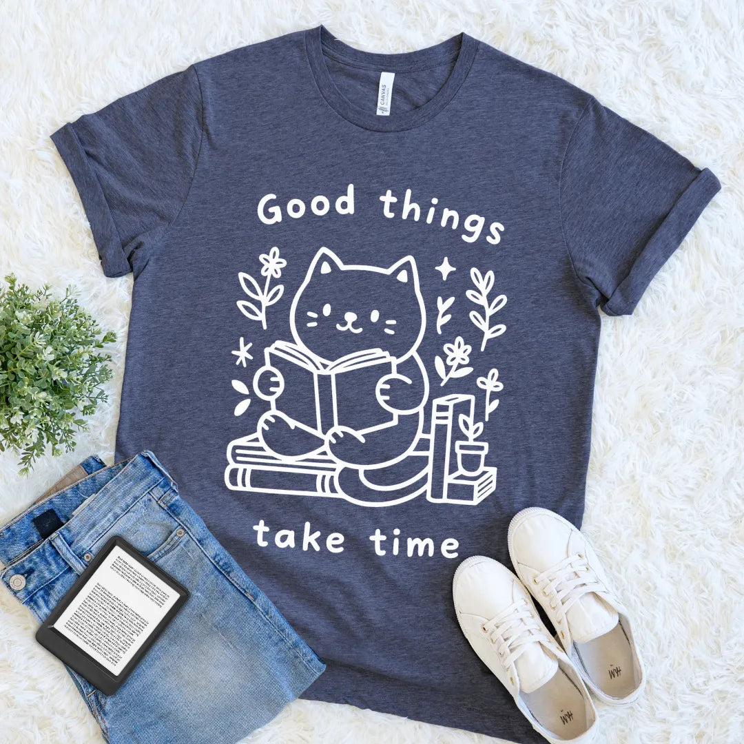 Flat lay of cozy cat-themed literary T-shirt in heather navy