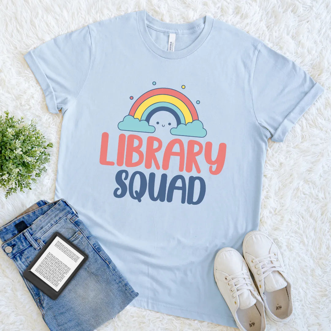 Light blue cute graphic shirt for book lovers with rainbow and text