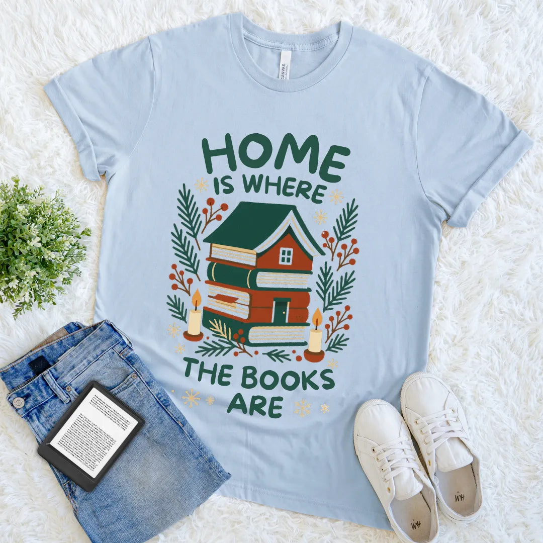 Holiday-inspired bookish tee with candles and winter greenery