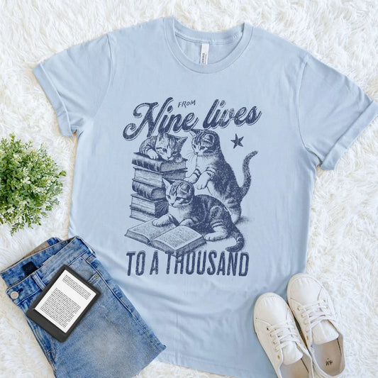 Light blue Vintage Bookish tee for introverts and feline fans who escape into fiction