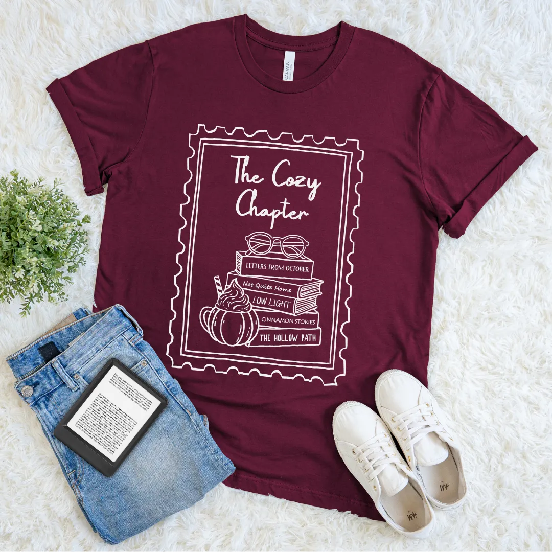 Hygge reader outfit maroon t-shirt with drawing of glasses, books, and whipped drink