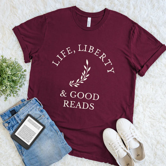 America 250 inspired literary shirt with Life, Liberty & Good Reads elegant typography design on maroon red cotton