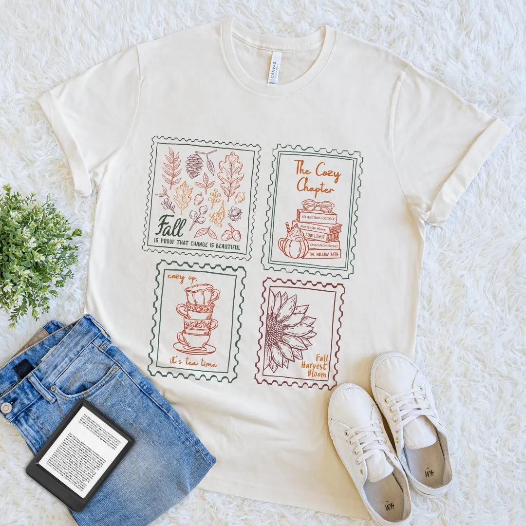 Cream T-shirt with fall-themed illustrated postage stamps