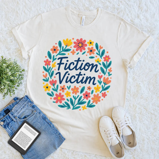 Cream T-shirt with “Fiction Victim” text inside floral wreath