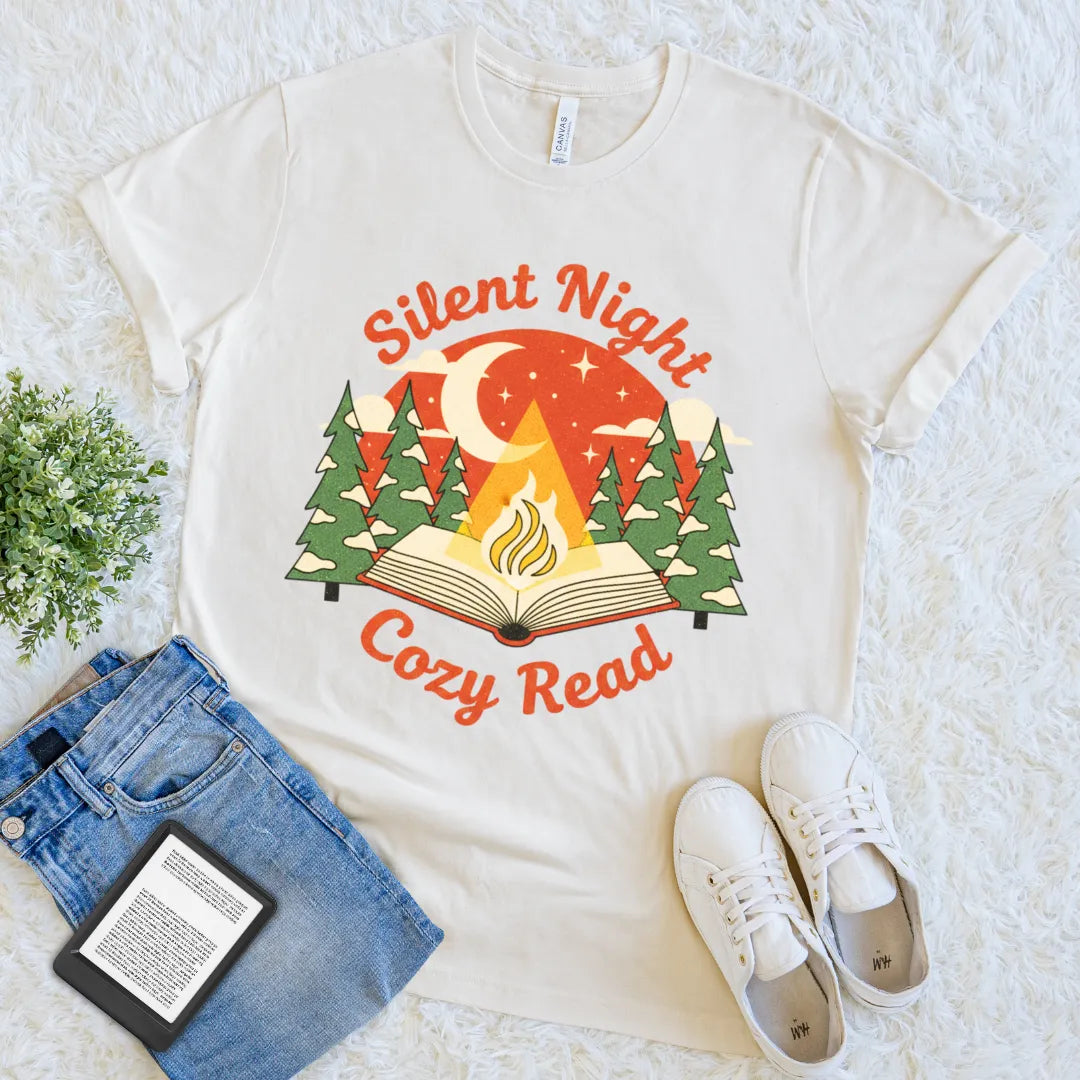 Cozy graphic tee featuring a fire glowing from the pages of a book