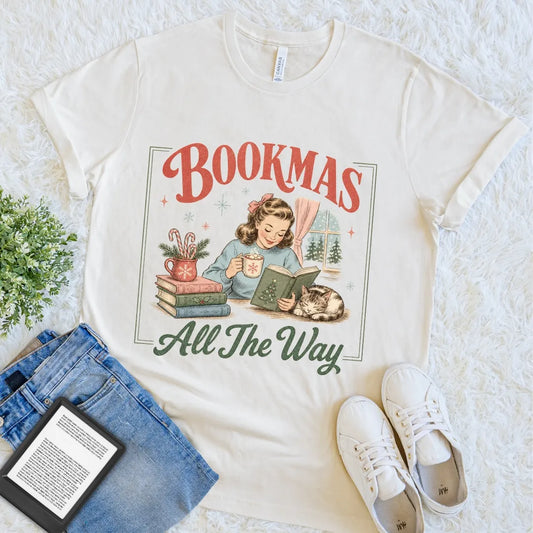 Festive literary graphic tee for readers who prefer books, cats, and warm drinks during the holiday season.