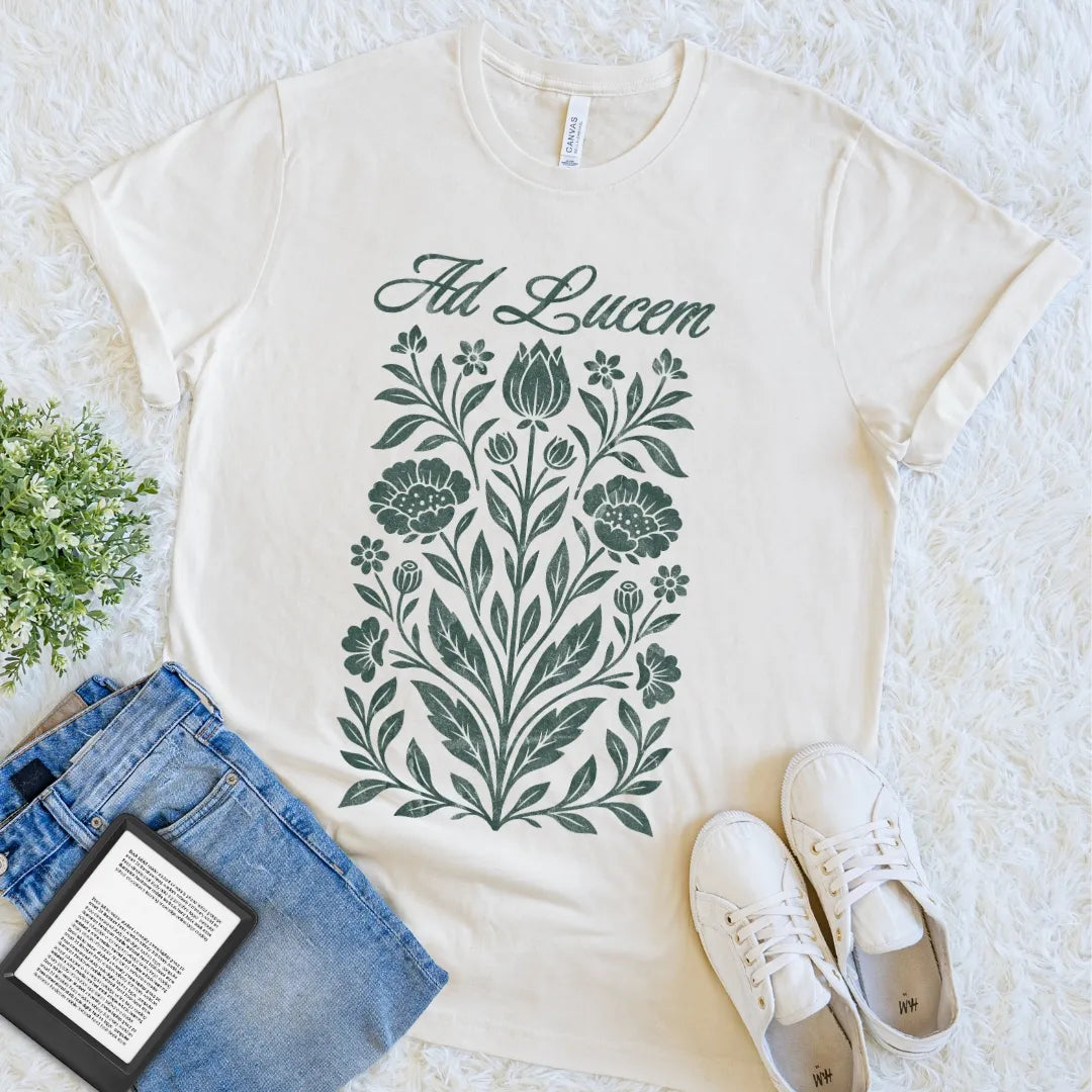 Natural Ad Lucem Latin quote T-shirt with detailed vintage botanical artwork and elegant script, a light academia floral tee for classical language lovers.