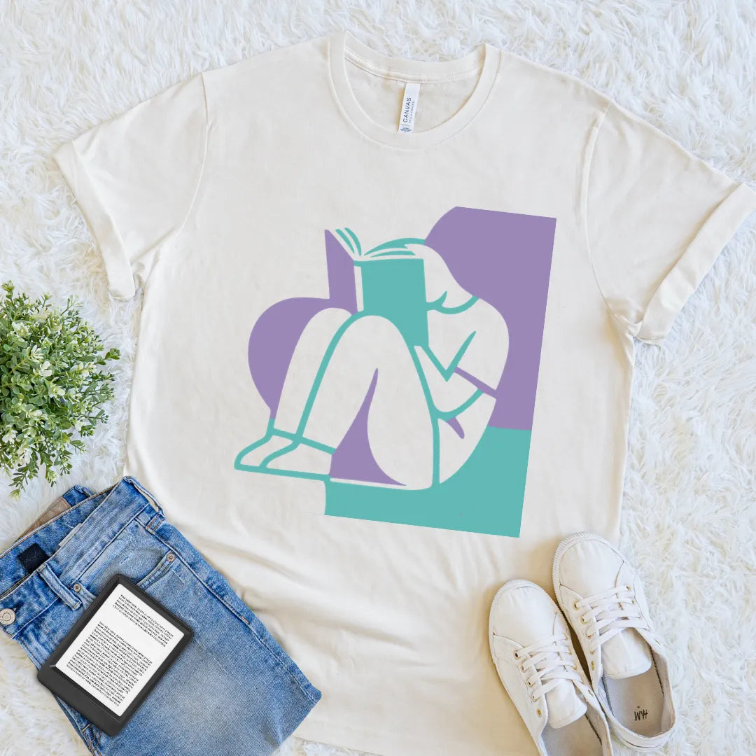 Natural Lost In A Book literary T-shirt featuring colorful teal and lavender geometric artwork of a reader, a minimalist book lover graphic tee.