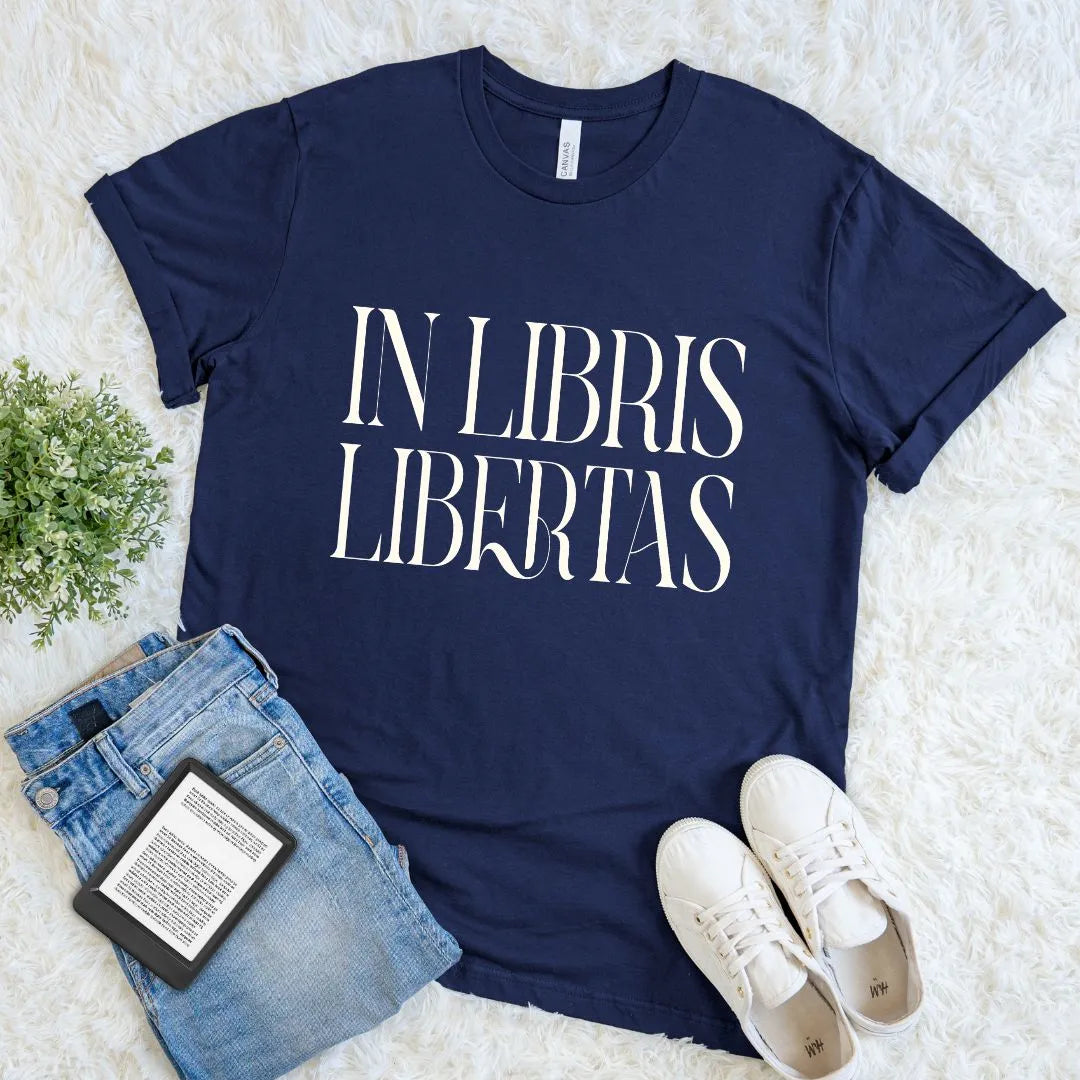 Minimalist literary navy blue tee with dark academia motto in bold serif typography