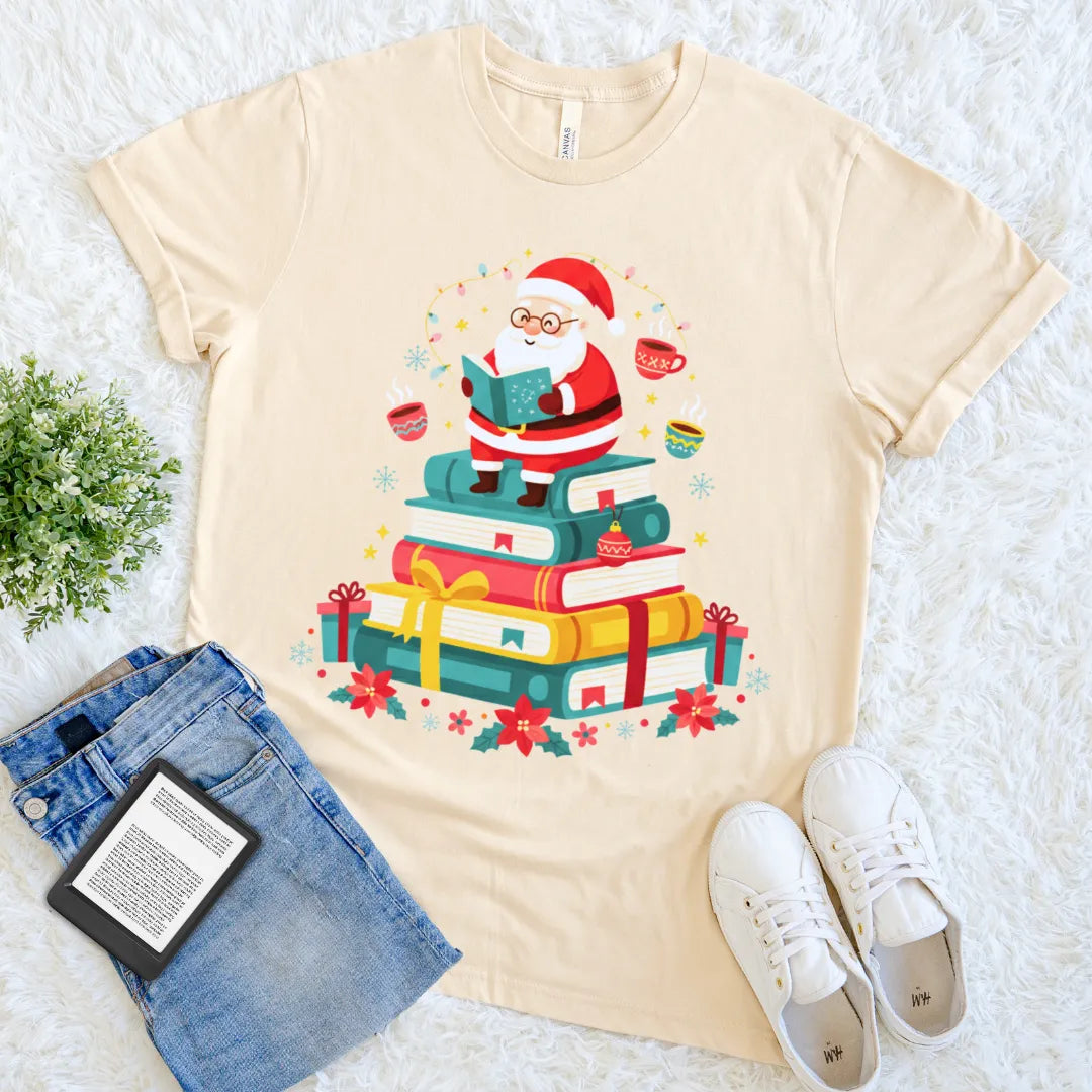 Cozy Christmas reader cream shirt with steaming mugs and ornaments