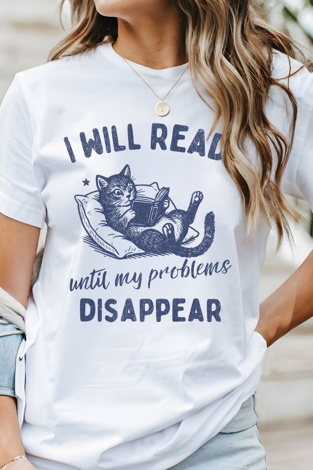 Woman wearing a funny book lover featuring vintage artwork with a cat reading a book and quote “I Will Read Until My Problems Disappear”