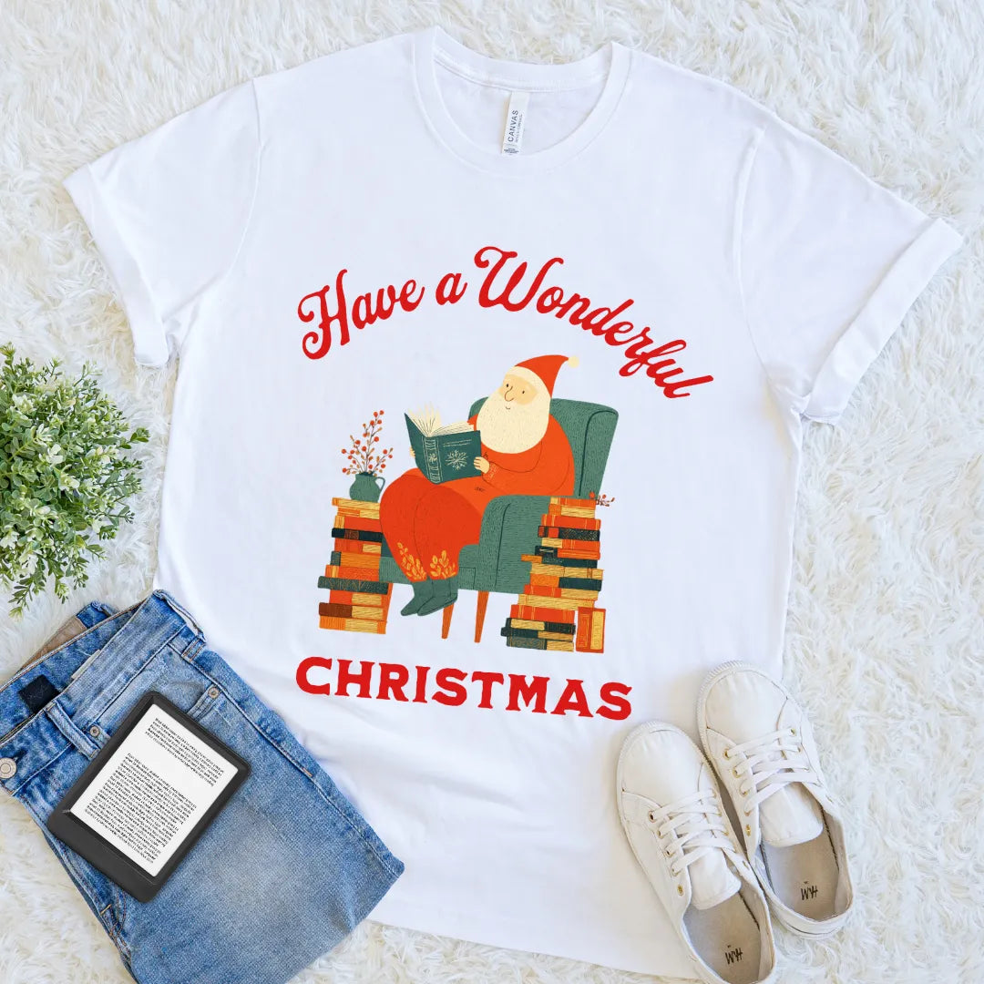 White tee with festive “Have a Wonderful Christmas” text and cozy Santa reading a book