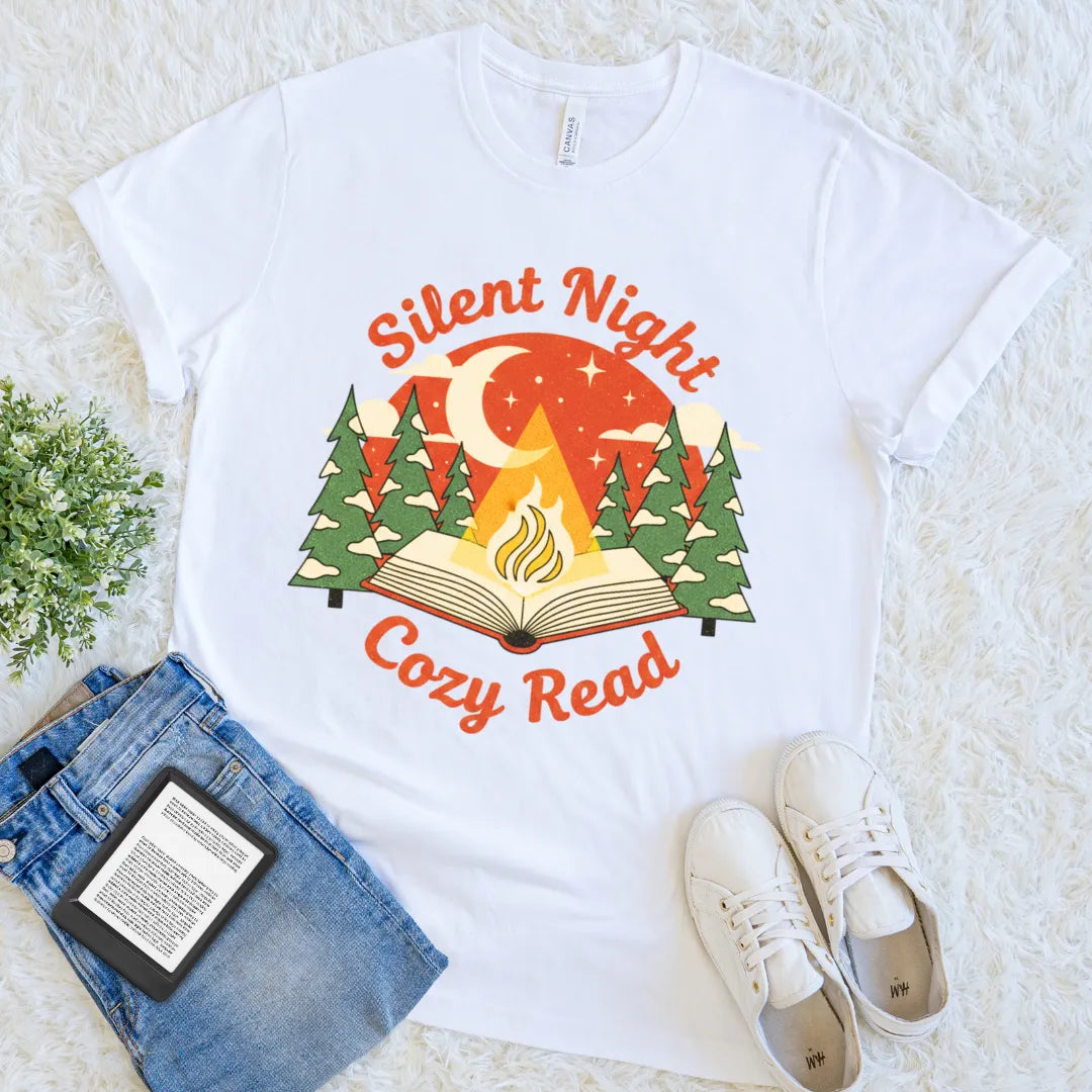 White T-shirt with open book campfire and pine tree illustration