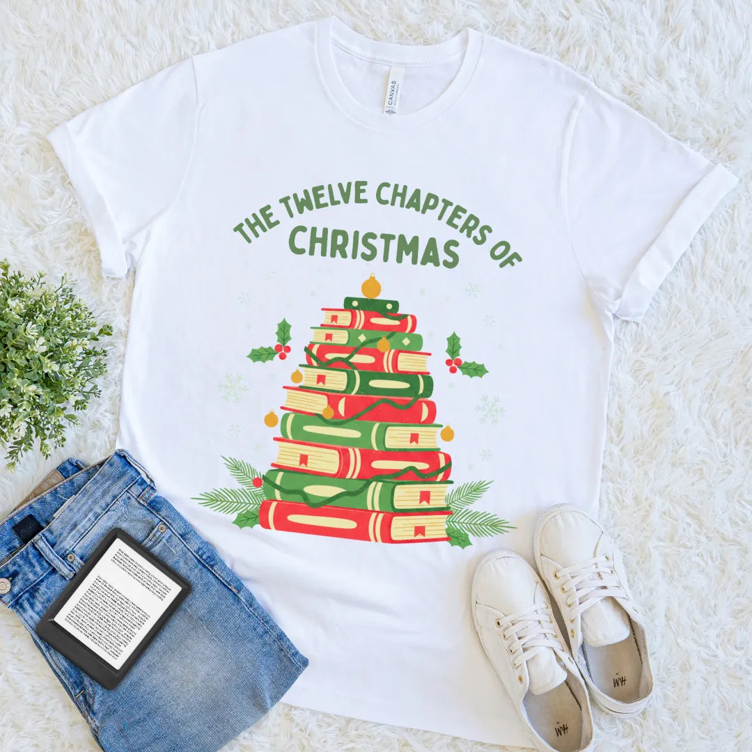 Graphic tee with holly, snowflakes, and book stack Christmas design