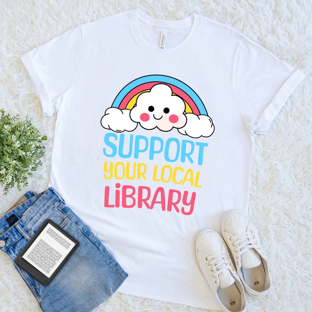Whimsical rainbow library support graphic on white shirt