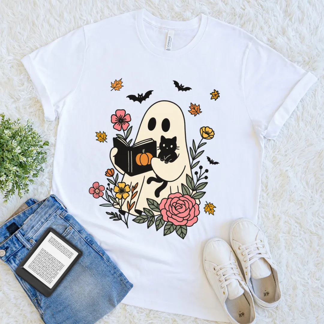 White Halloween T-shirt with ghost holding a book and black cat among flowers