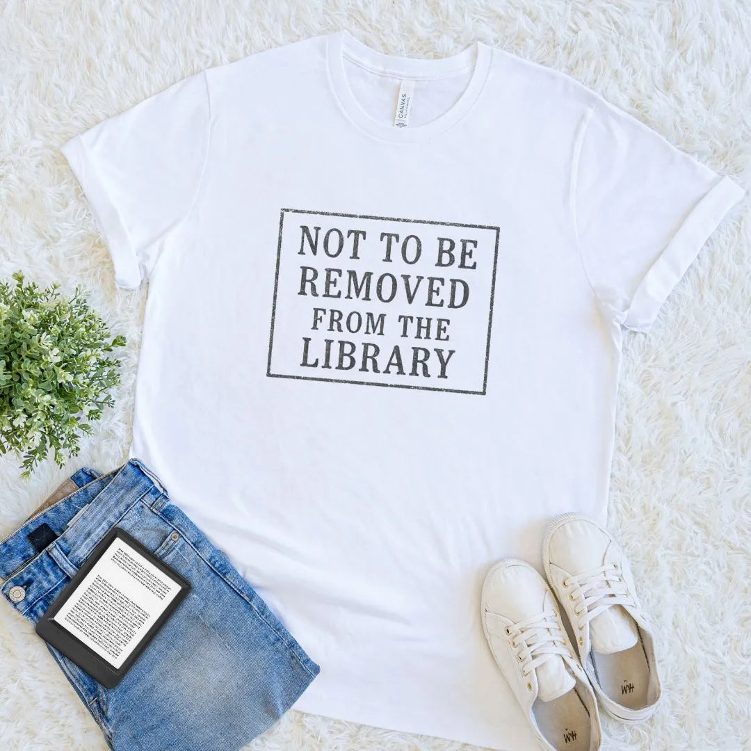 white soft cotton bookish T-shirt with black “Not To Be Removed From The Library” stamp text