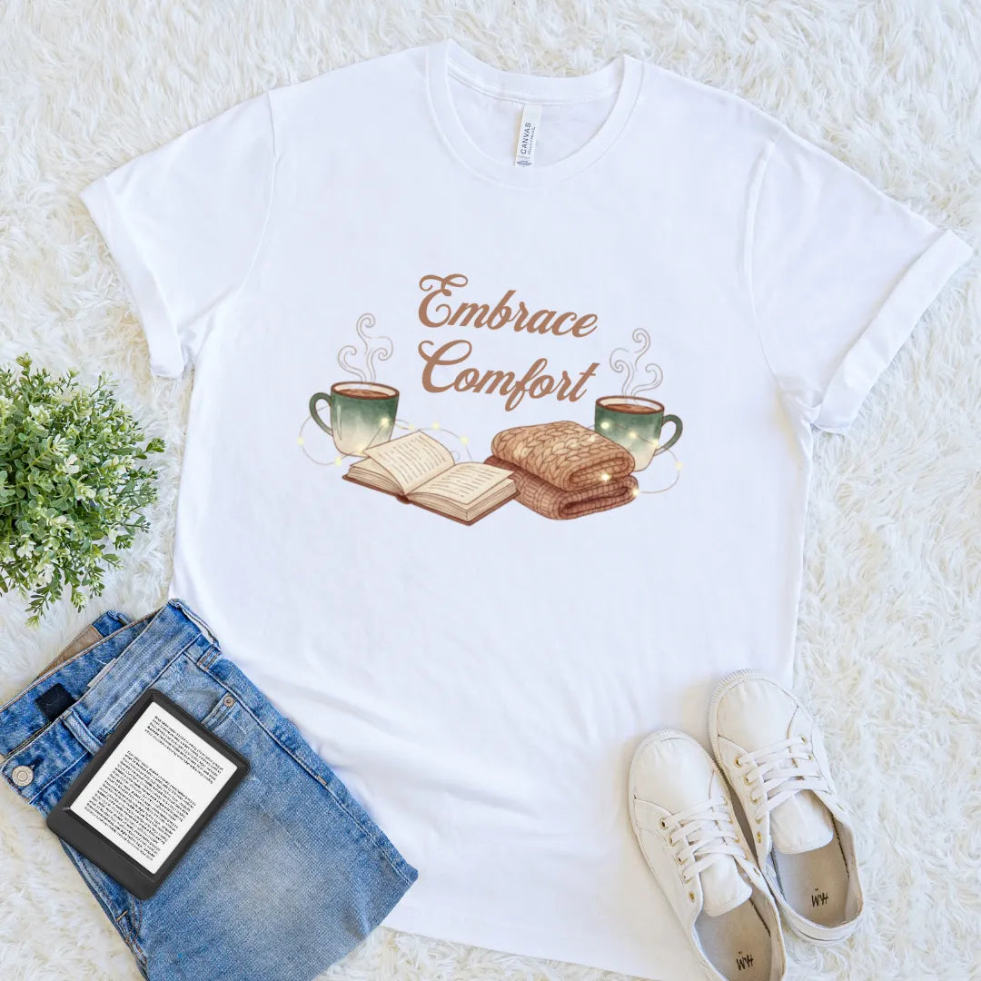 Soft cotton white reader tee with warm, inviting vibes and “Embrace Comfort” text
