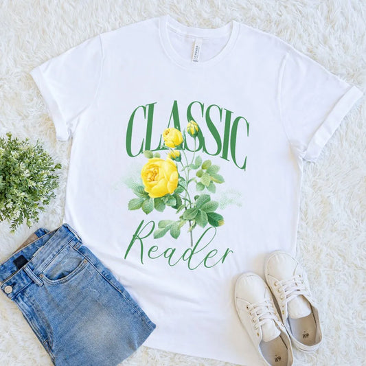 White vintage reader shirt with floral rose design and elegant typography on soft white fabric