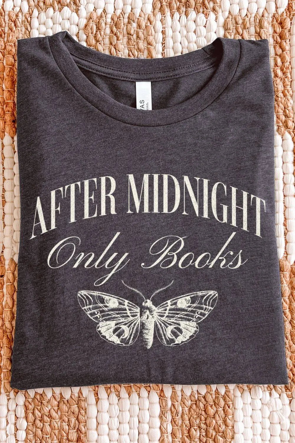 Soft dark grey heather graphic t-shirt with the phrase “After Midnight Only Books” and a vintage moth illustration in a moody dark academia style, folded on textile surface