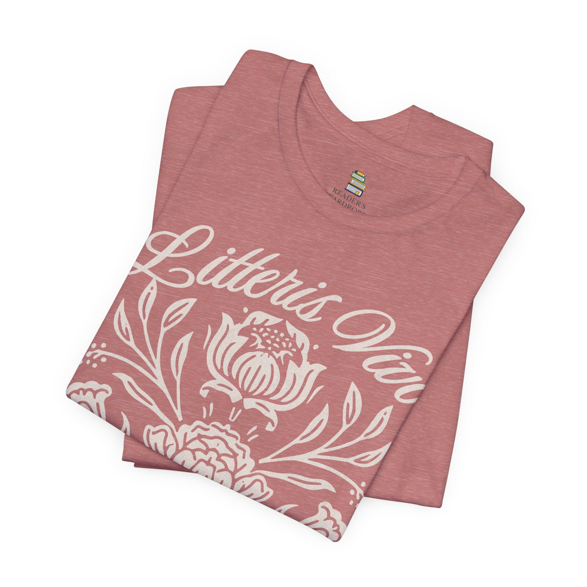 Folded heather mauve book lover tee highlighting the Litteris Vivo lettering, botanical artwork, and Reader’s Wardrobe neck label