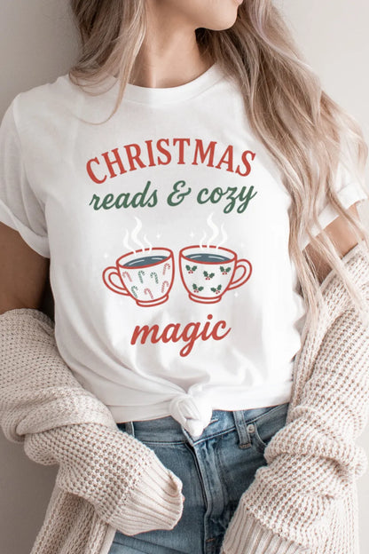 Woman wearing white Christmas t-shirt outfit with two teacups and warm message