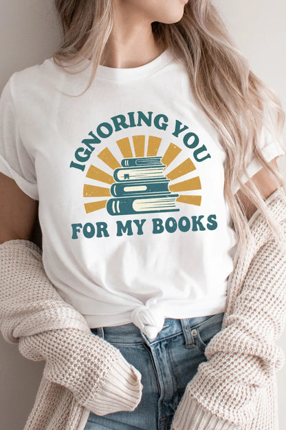 woman wearing Cozy gift t-shirt for readers who’d rather stay in and read with   “Ignoring You for My Books” quote