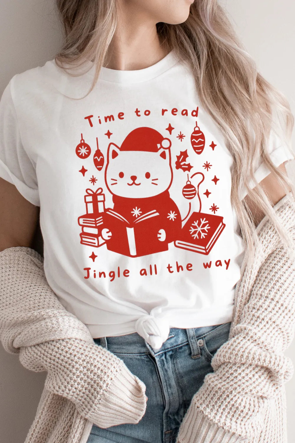 woman wearing cute holiday cat T-shirt holding a book