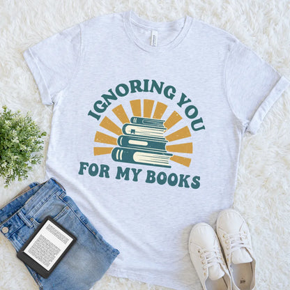 Vintage-style reader t-shirt with stack of books and sunburst in grey