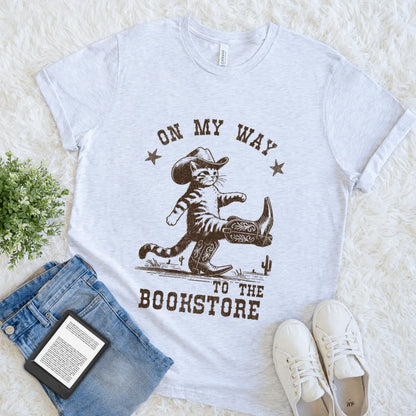 Funny bookish shirt with vintage boot-scootin’ cat and bold bookstore quote in ash gray