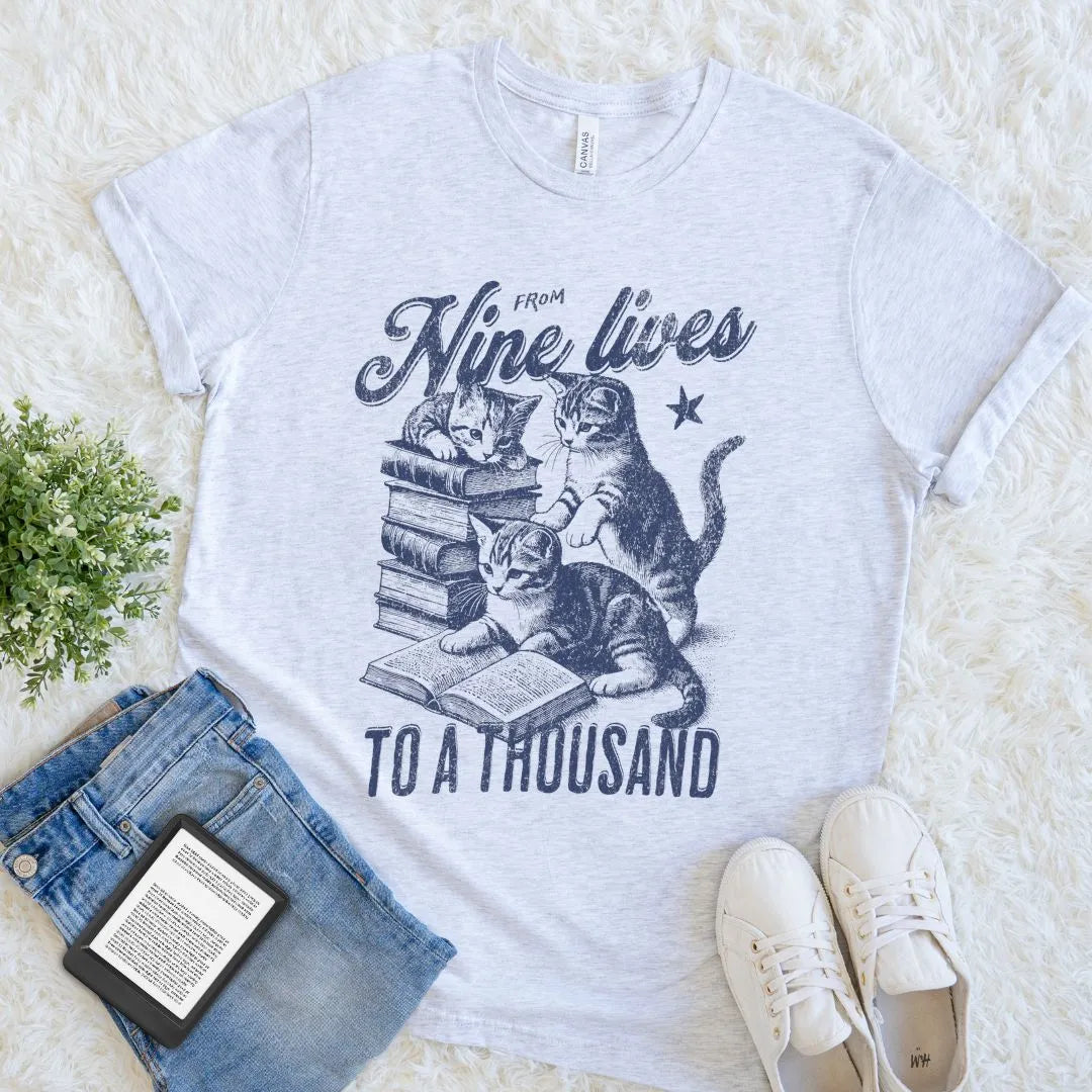Light heather gray T-shirt with vintage-style kitten and book illustration