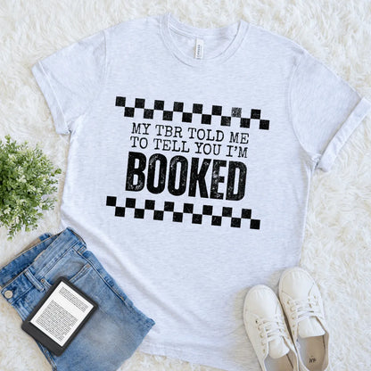 Cozy aesthetic outfit with literary-themed shirt and reading essentials 