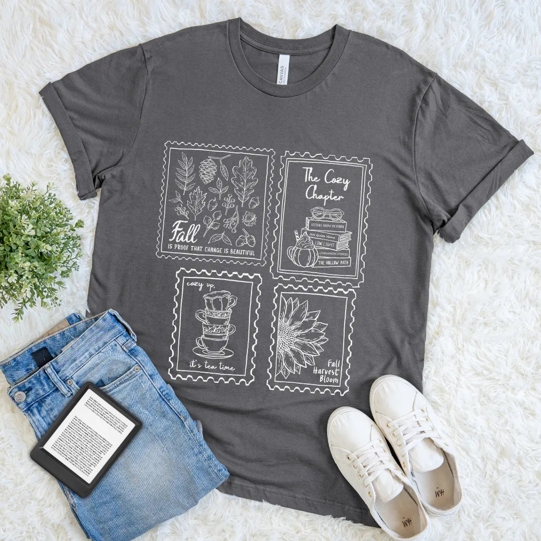 hand-drawn Illustration of books, tea, leaves, and sunflower on grey shirt