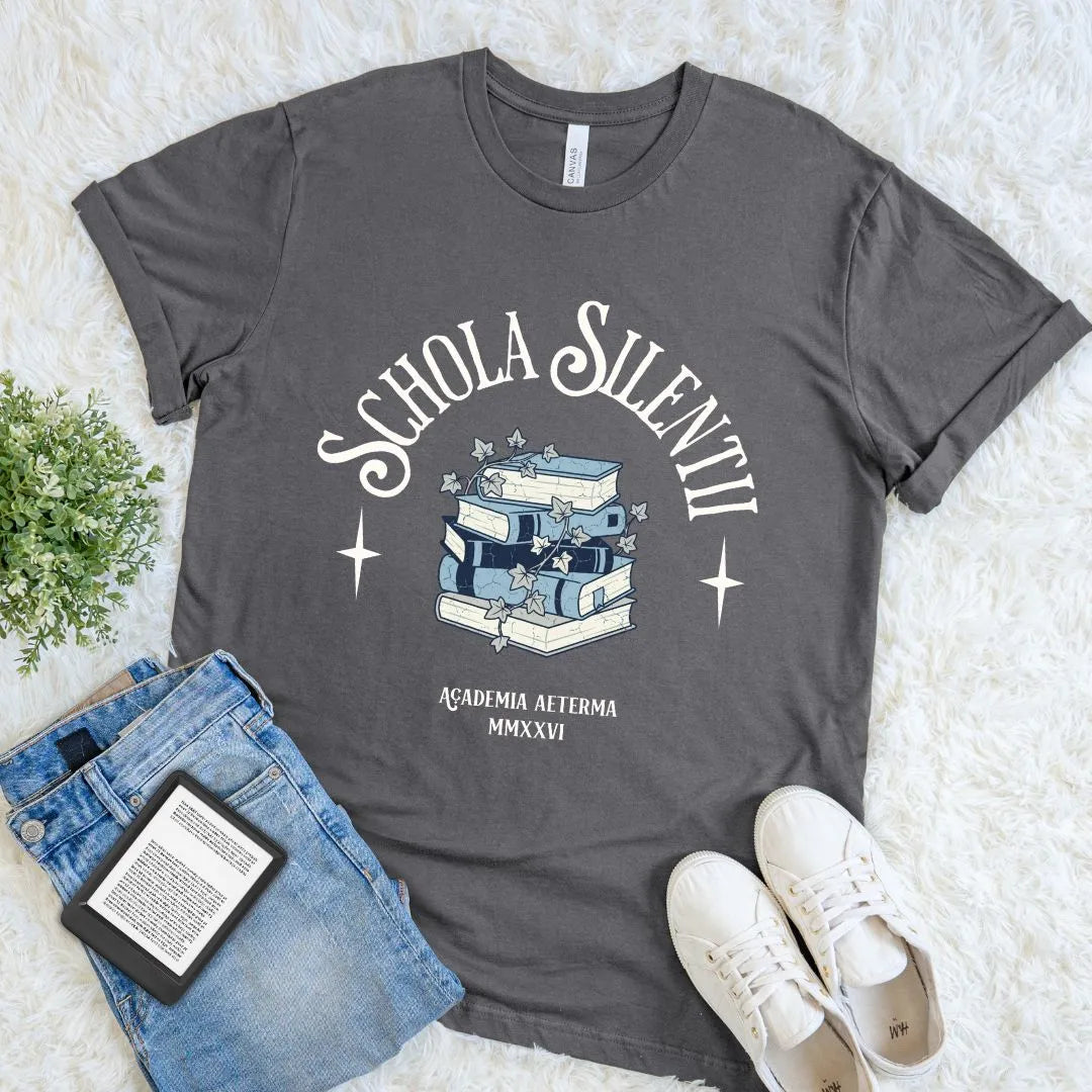 Aesthetic reading themed T-shirt with dark academia book pile and latin quote in elegant typography on asphalt grey fabric