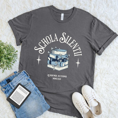 Aesthetic reading themed T-shirt with dark academia book pile and latin quote in elegant typography on asphalt grey fabric