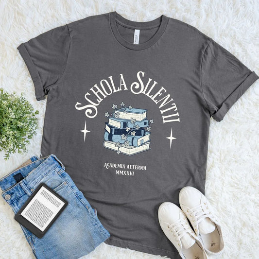Aesthetic reading themed T-shirt with dark academia book pile and latin quote in elegant typography on asphalt grey fabric