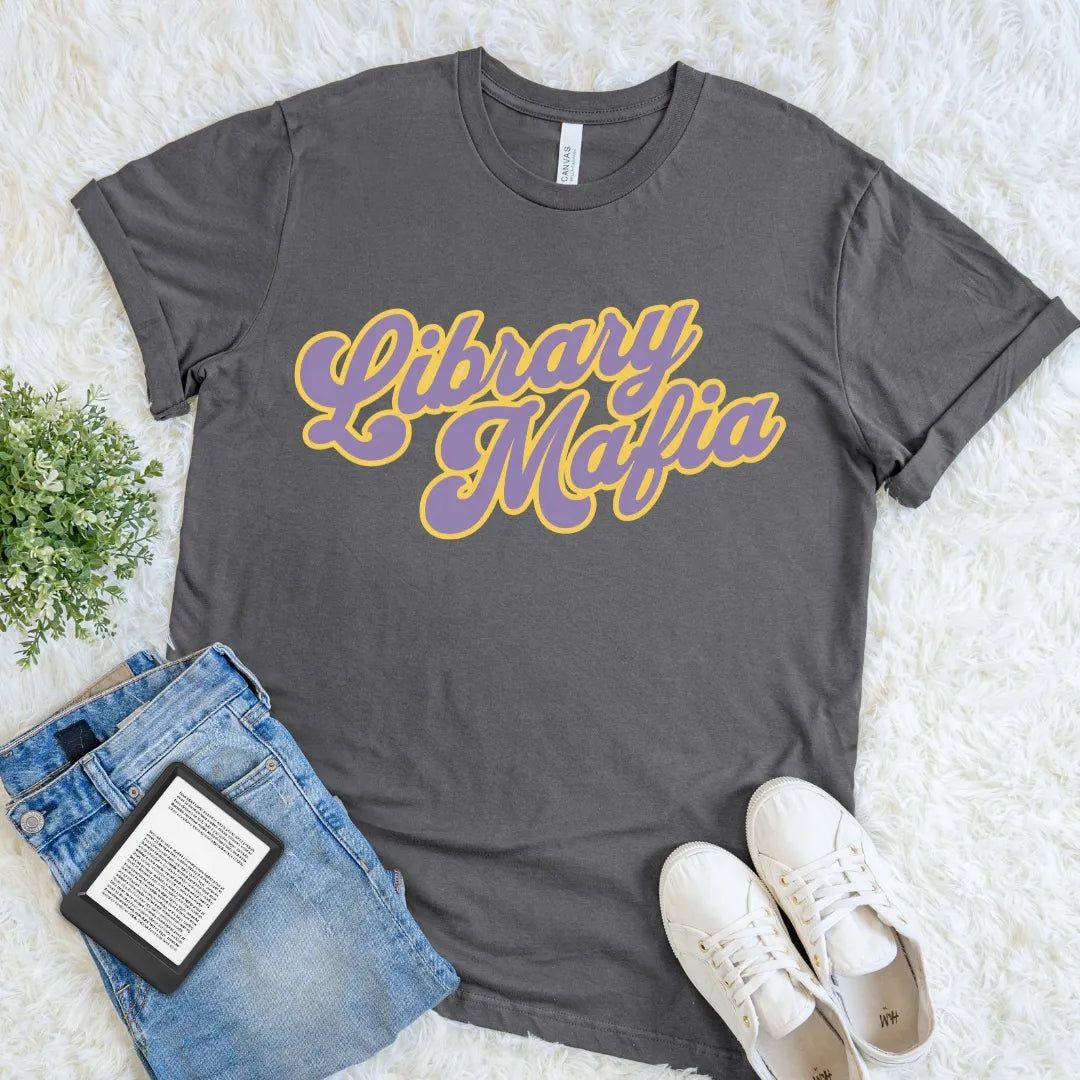Asphalt Library Mafia T-shirt with bold purple and golden-yellow retro script for readers and library regulars