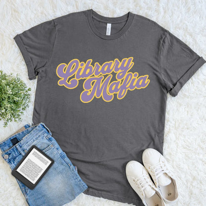 Asphalt Library Mafia T-shirt with bold purple and golden-yellow retro script for readers and library regulars