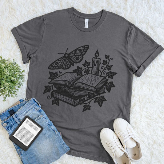 asphalt gray bookish T-shirt with vintage illustration of books, candle, moth, and ivy in gothic style