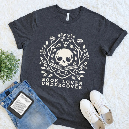 Dark Grey Heather dark academia tee featuring a literary skull framed by winding branches, leaves, and wildflowers