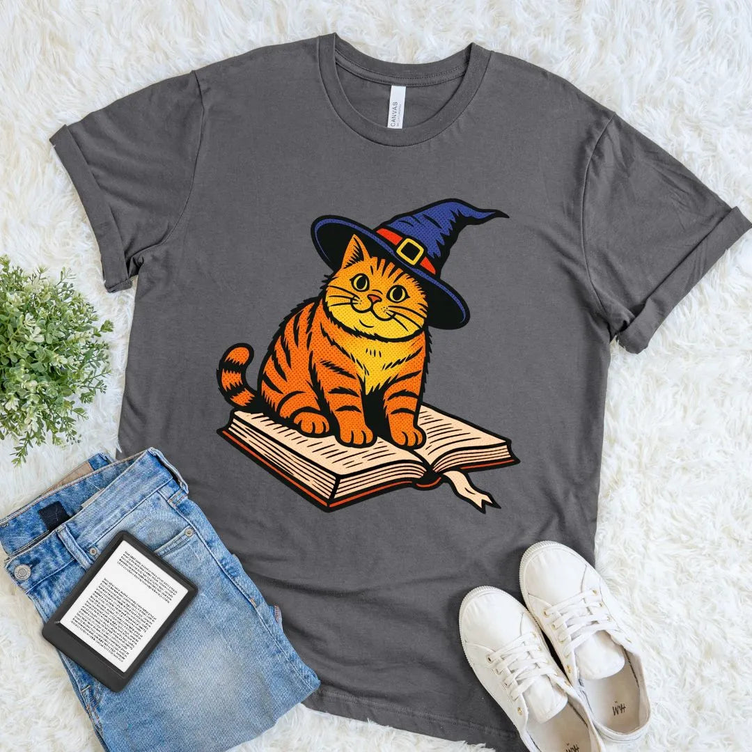 Charcoal reader shirt with adorable orange cat wearing a witch hat on an open book