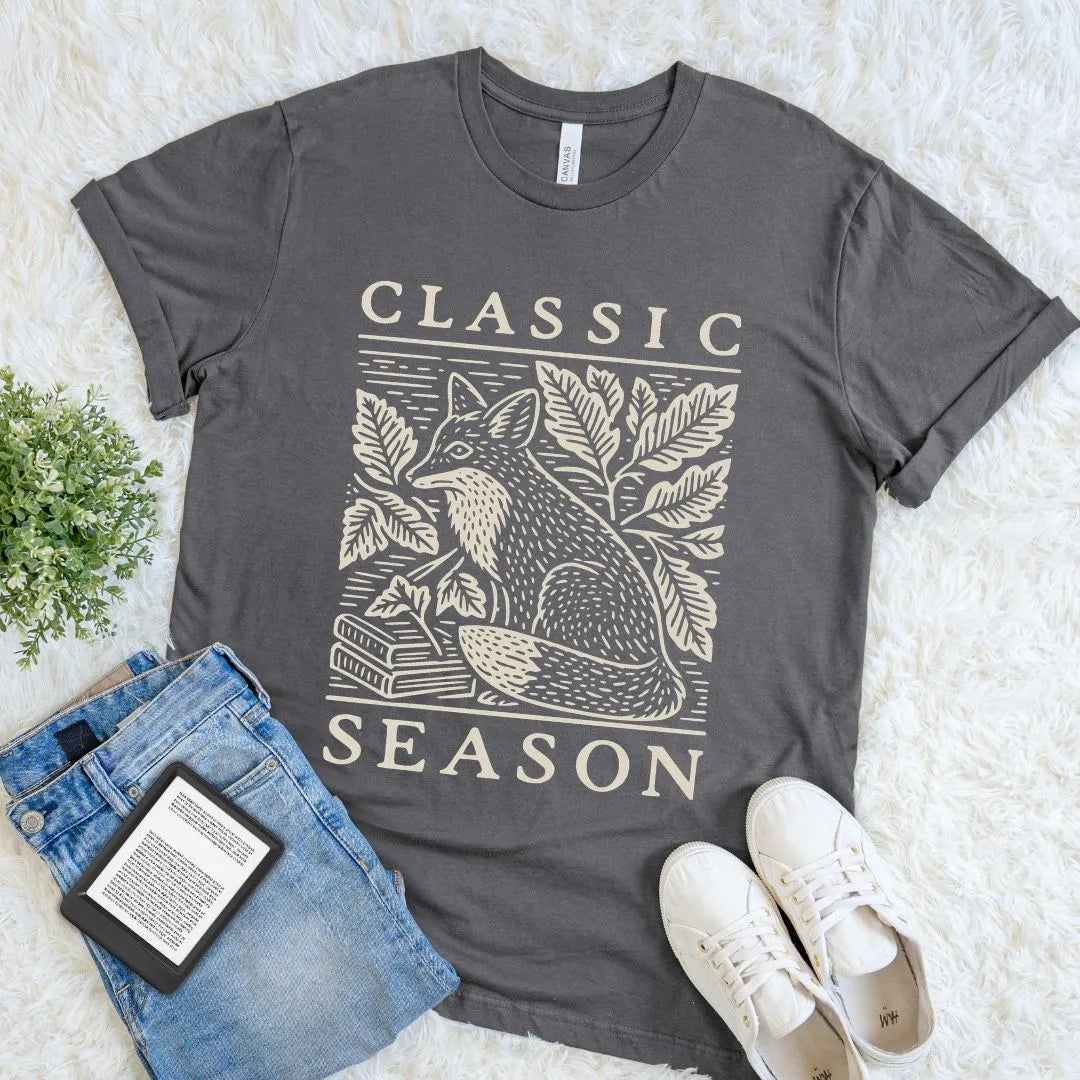Asphalt reader shirt combining a vintage woodcut fox and stacked books with the phrase Classic Season